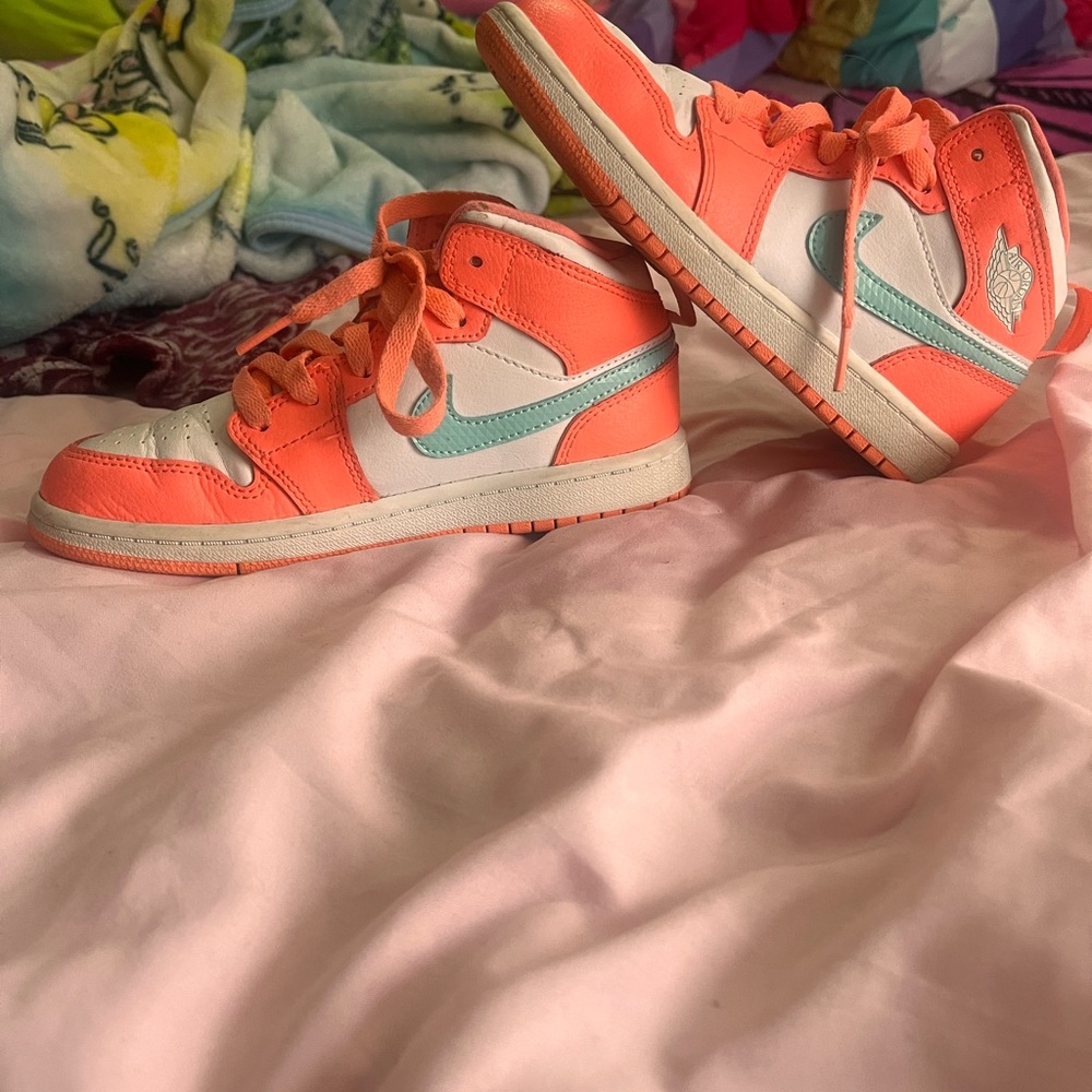 USED size 1y Jordan’s. Neon pinkish, white and light blue.